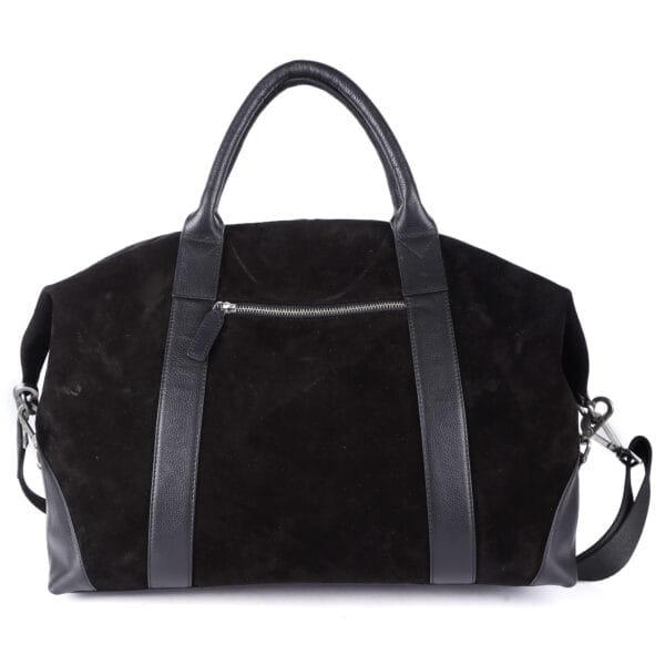 Handcrafted leather bags on display by custom bag manufacturer