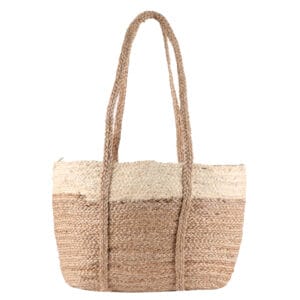 A beautifully handcrafted natural jute bag displayed on a wooden surface by a leading exporter of jute from India.