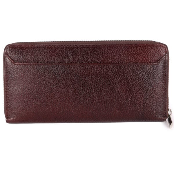 Back view of a maroon leather women wallet with pebbled texture and zip closure