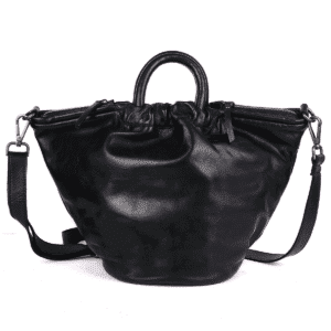Black leather barrel-shaped handbag with drawstring top, mini handles, and adjustable crossbody strap.