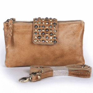 Tan leather crossbody bag with metallic stud flap and detachable strap from a reputed crossbody bag manufacturer.