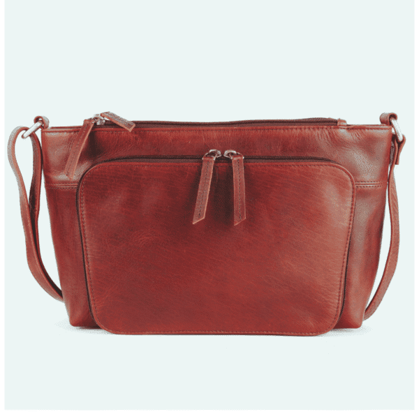 Handmade leather crossbody bag in rich brown with dual zipper compartments and adjustable strap.